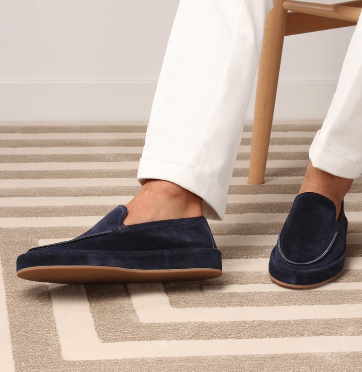 Classic men's slip-on loafers with cushioned interior. Elegant design for smart casual and business wear.