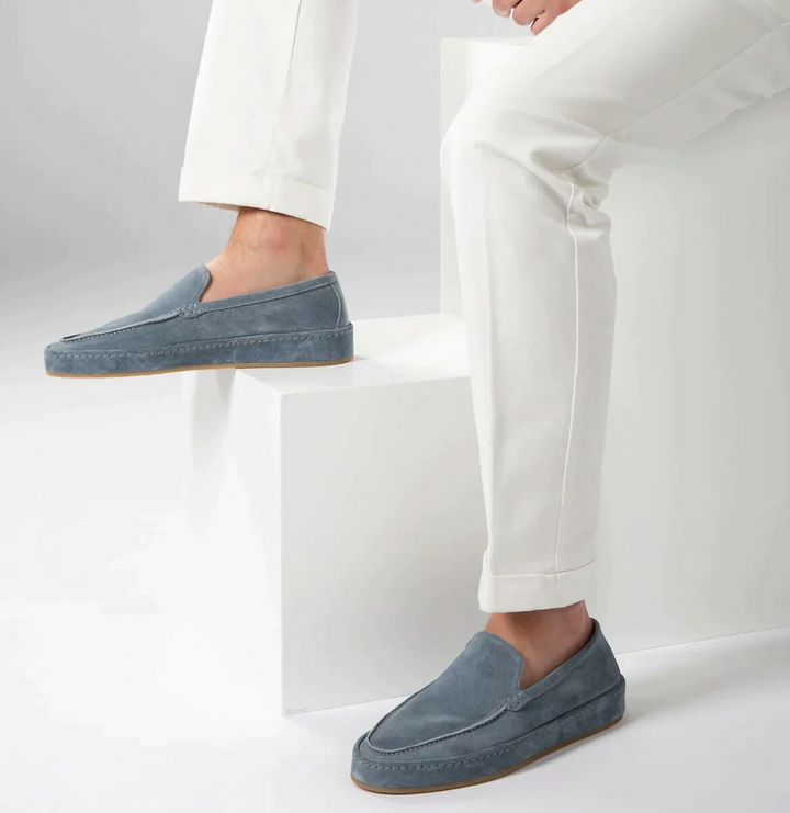 Modern men's slip-on loafers, combining cushioned comfort with elegant, versatile business casual style.