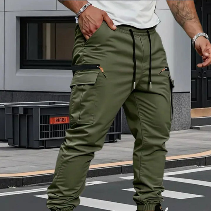 Durable men's cargo jogger pants with adjustable waist, great for activewear and a modern tapered look.