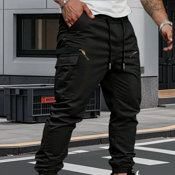 Men's flexible jogger cargo pants, stretch fabric for comfort, tapered fit, suitable for casual & active use.