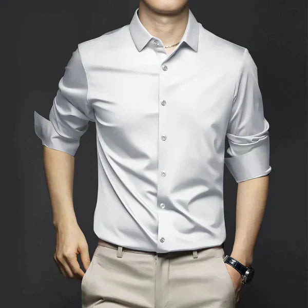 Close-up of a blue men's stretch slim fit dress shirt fabric, highlighting the flexible material.