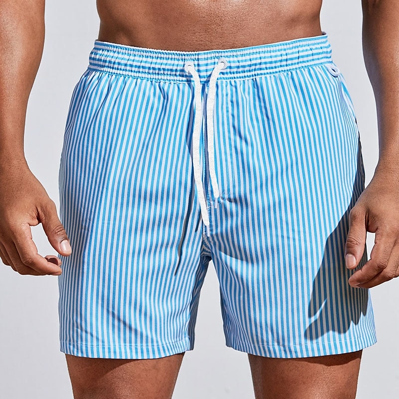 Comfortable men's striped swim trunks with adjustable drawstring waist, perfect for athletic beach wear.