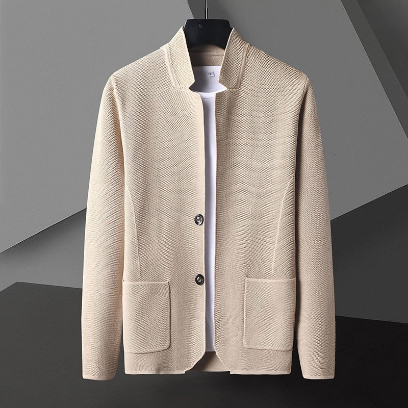 Close-up of gray men's knit jacket texture, highlighting structured fabric & button detail