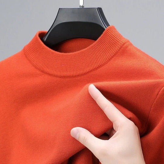 Man wearing a comfortable grey mock neck pullover sweater with jeans, perfect for casual everyday wear.