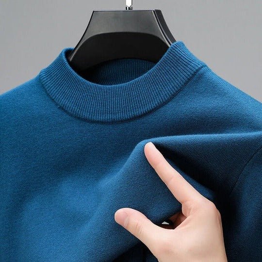 Close-up of the ribbed mock neck and soft knit fabric of a men's versatile long sleeve pullover.