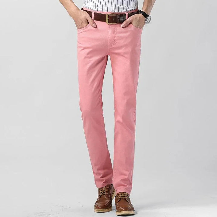 Man wearing vibrant blue men's casual trousers, showcasing modern fit & comfortable style.