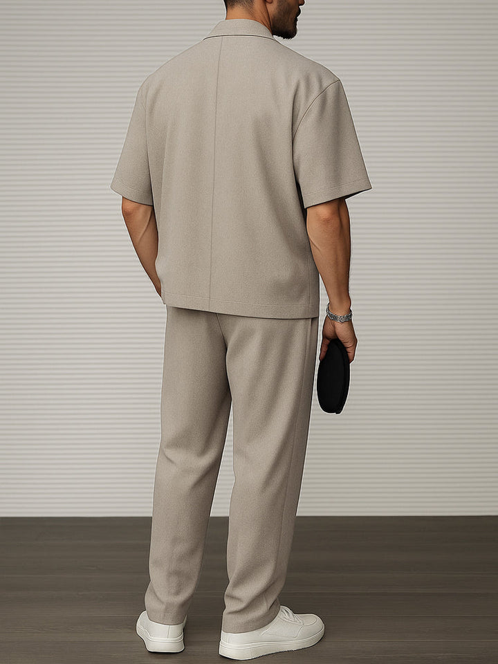 Men's two-piece short sleeve blazer & tailored trousers set in a modern, smart casual style. Versatile men's fashion.