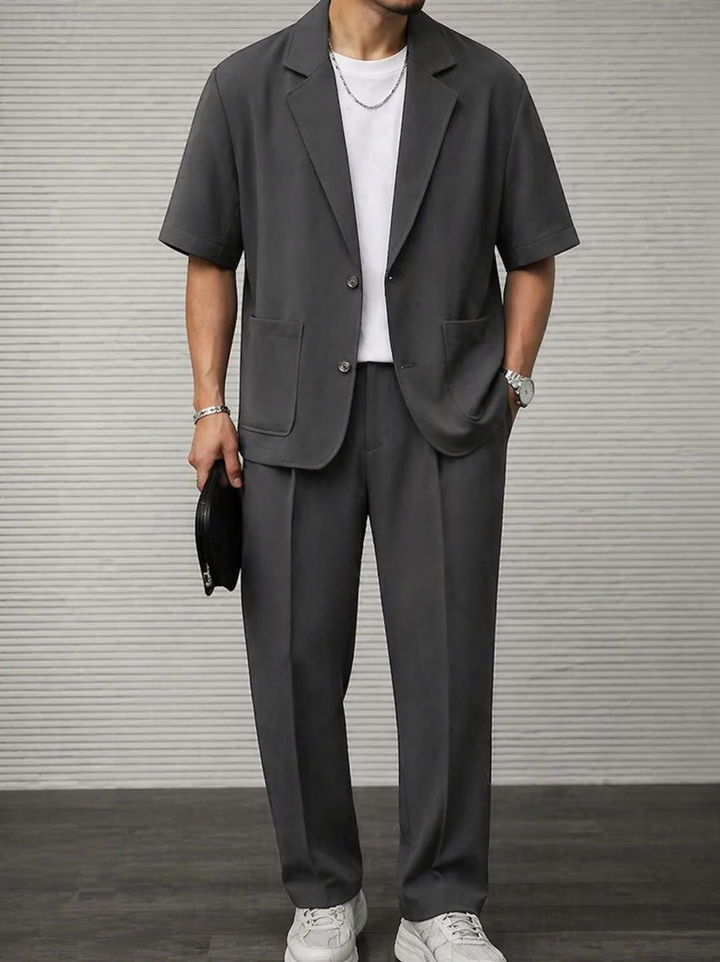 Tailored men's short sleeve blazer & matching trousers. A sharp two-piece set for modern men's smart casual fashion.