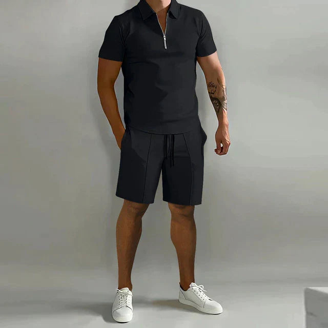 Man enjoying a casual day in a stylish men's summer two-piece polo and shorts set. Relaxed fit.