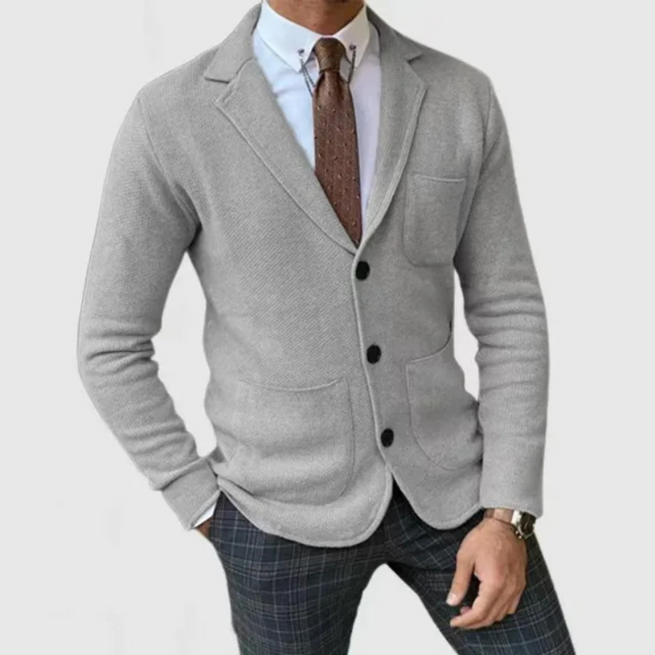 Elegant men's two-button blazer with a classic notch lapel, great for smart casual layering & business.