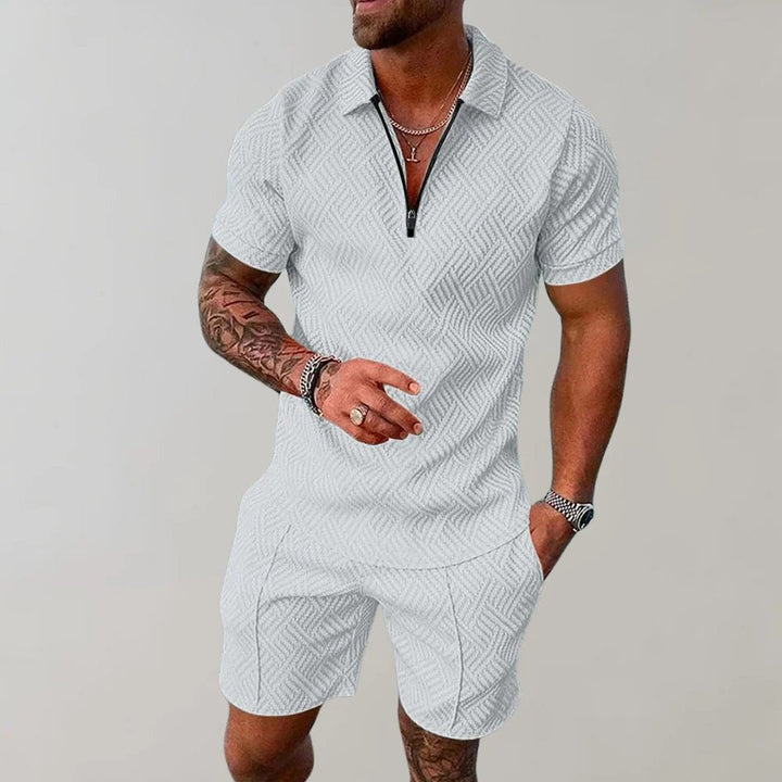 Modern men's matching zip polo shirt and shorts set. Ideal for warm weather, casual fashion, and stylish mens clothing.