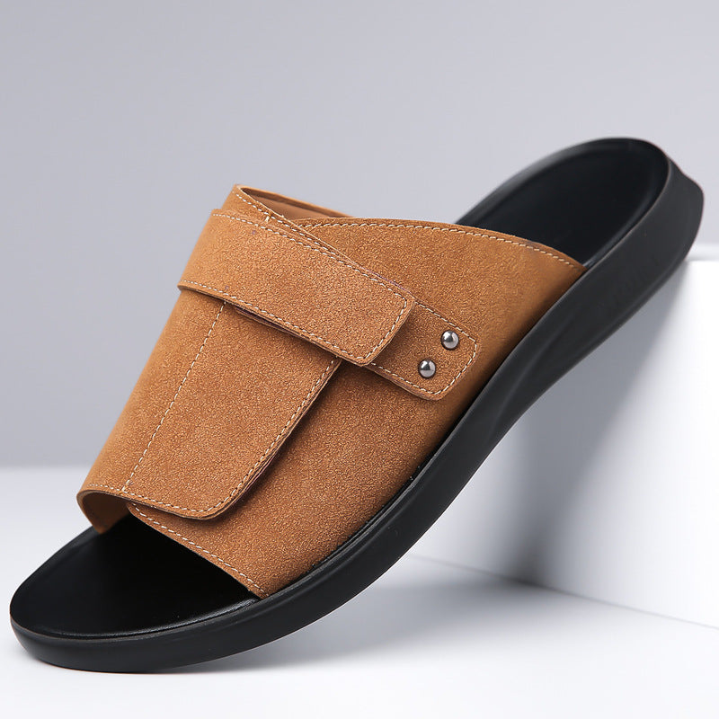 Close-up of the soft suede texture on men's slide sandals with an adjustable strap.