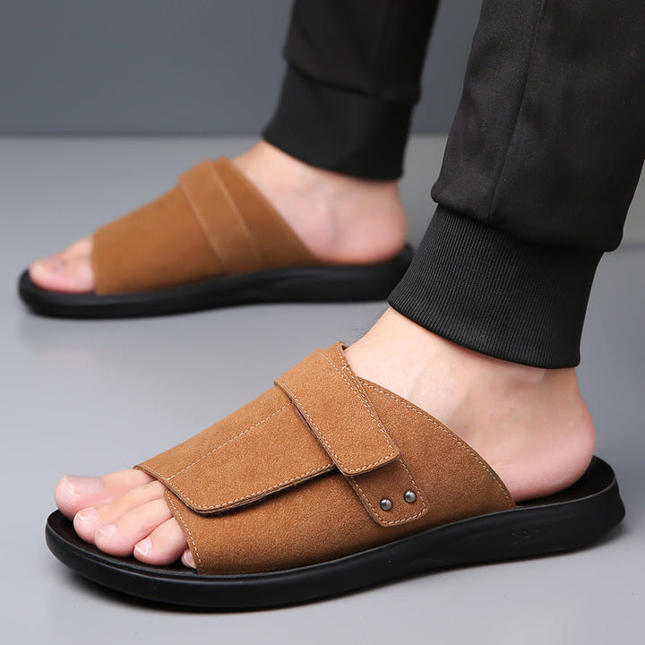 Comfort-focused men's suede slides, designed for relaxation and resort wear.