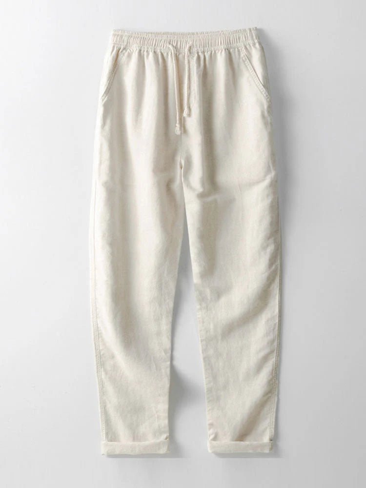 Stylish men's two-piece summer outfit: casual shirt & pants set. Relaxed fit, rolled cuffs, beach style.