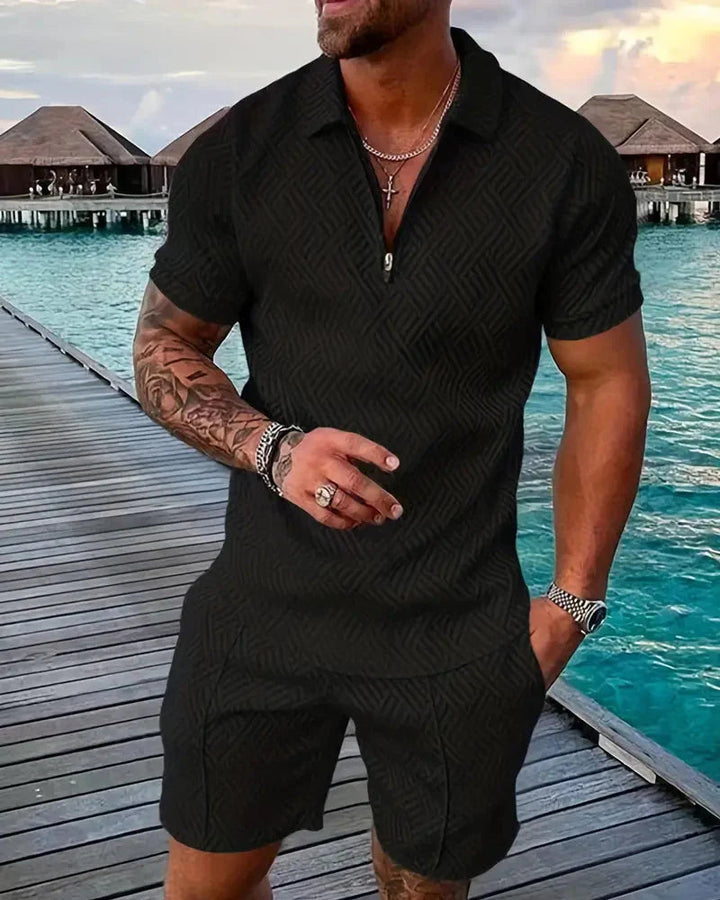 Casual men's summer tracksuit set featuring a stylish zip collar polo shirt and co-ordinating shorts.