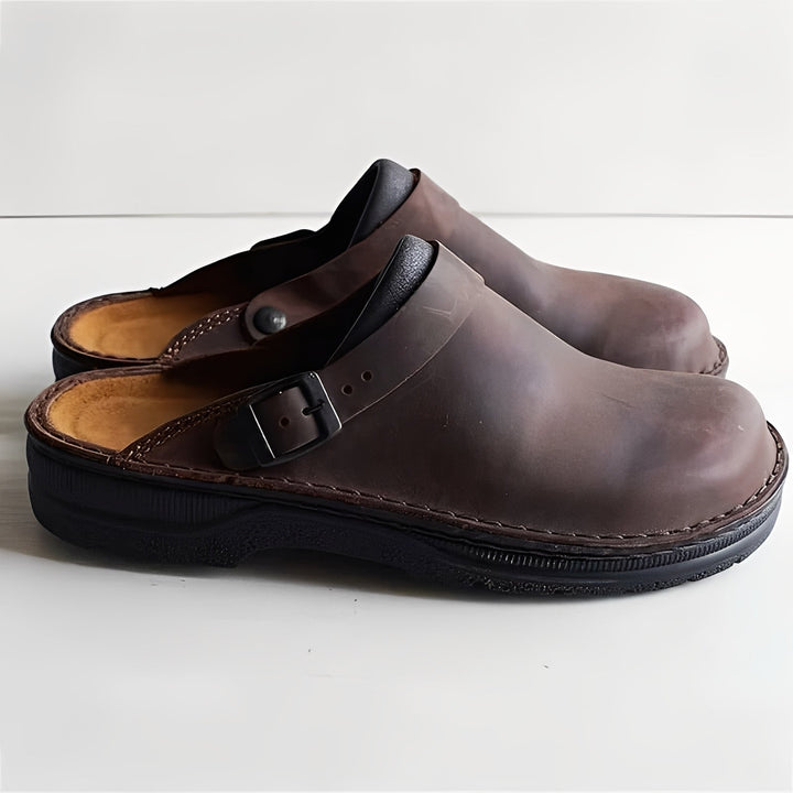 Indoor men's slippers, comfort footwear providing foot support for all-day home relaxation.
