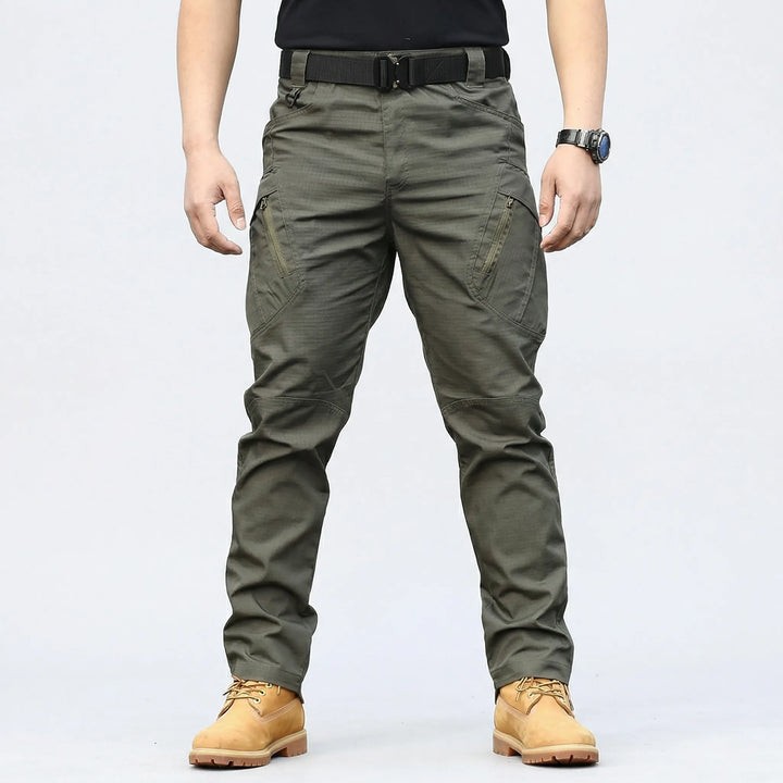 Rugged men's tactical work pants, weather-resistant, perfect for hiking, adventure, and outdoor tasks.