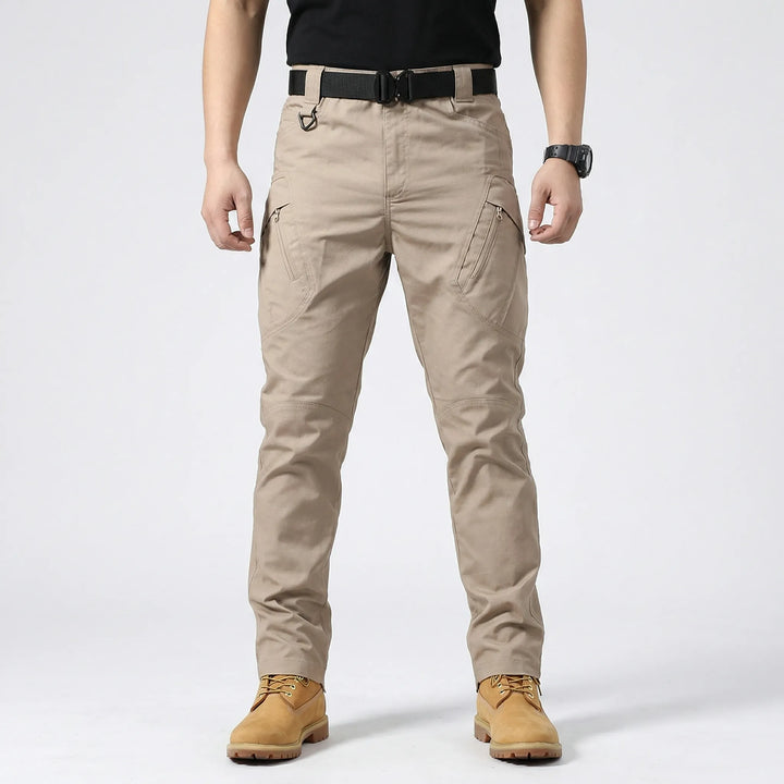 Durable men's adventure pants, multi-pocket design (9), stretch fabric for tactical and work utility.