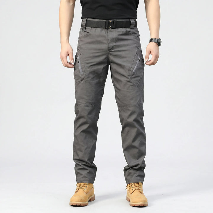 Men's durable tactical cargo pants, 9 pockets, comfort fit for hiking, work, and outdoor activities.