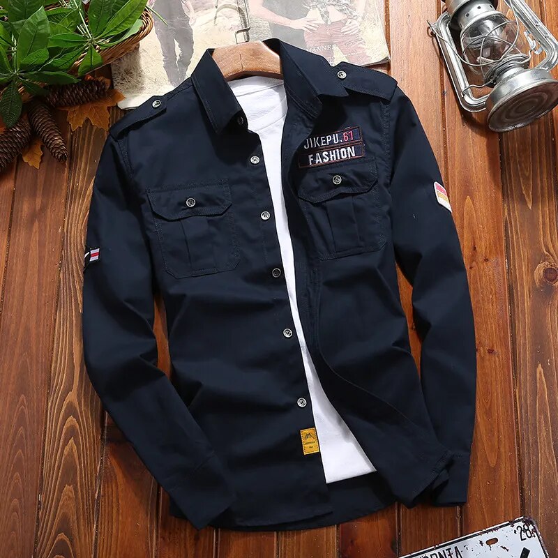 Men's long sleeve utility field shirt. Features epaulettes & two button-flap chest pockets. Military style casual.