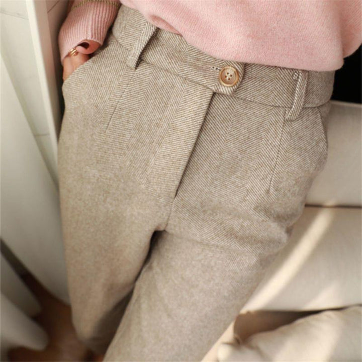 Full shot of a man wearing tailored ankle pants, showcasing the modern fit and smart casual style