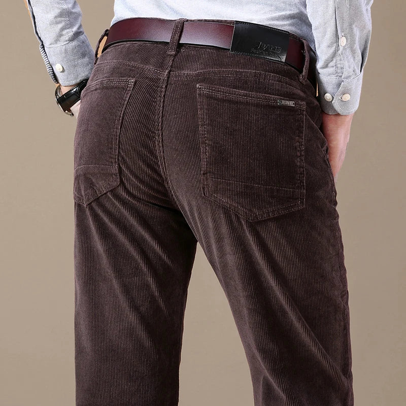 Men's tailored corduroy dress trousers in a rich brown color, ideal for winter fashion.