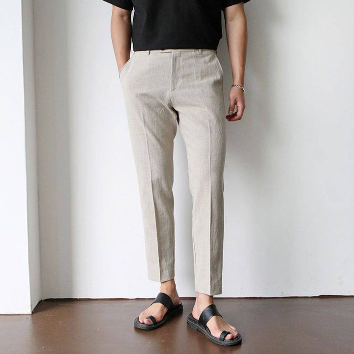 Man wearing stylish tailored fit summer trousers, perfect for smart casual & dress occasions. Comfortable men's fashion.
