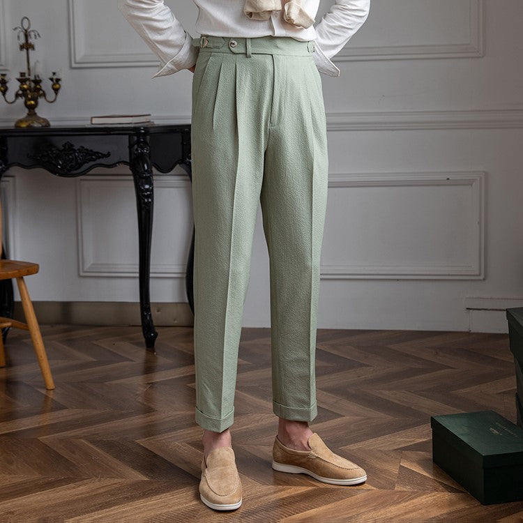 Refined men's pleated high-waist trousers, a smart choice for professional or dress occasions.