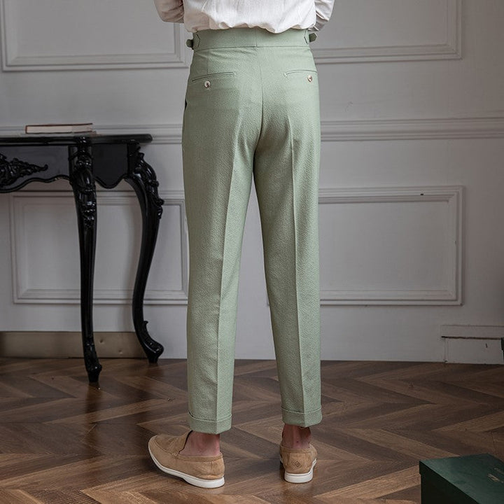 Sleek modern men's high-waist tailored pleated trousers for contemporary style & comfort.