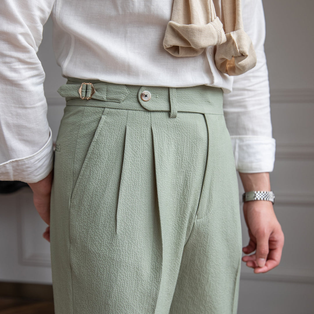 Classic men's tailored high-waist pleated dress pants for a sophisticated modern fashion look.