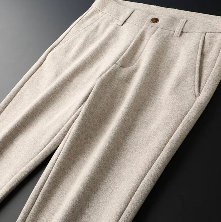 Men's dark grey tailored pants, providing a sleek and professional appearance.