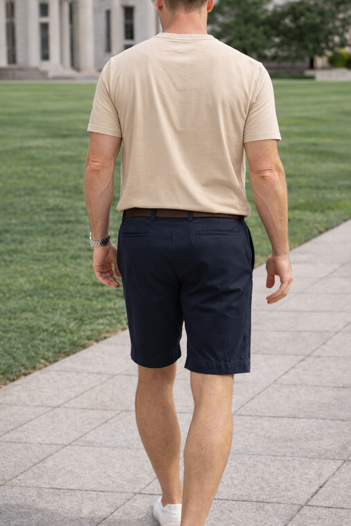 Classic men's tailored flat-front shorts with stretch fabric, offering a comfortable, modern fit for summer.