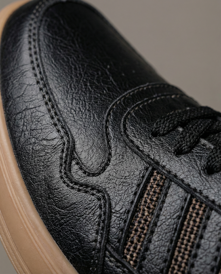 Men's classic black leather sneakers, offering comfort & durability for everyday fashion