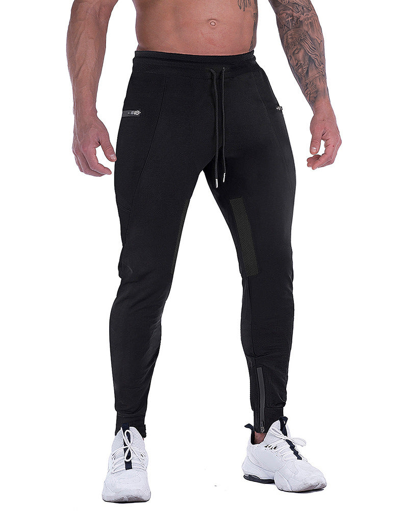Close-up of men's tapered athletic joggers, showcasing elastic waistband and drawstring detail