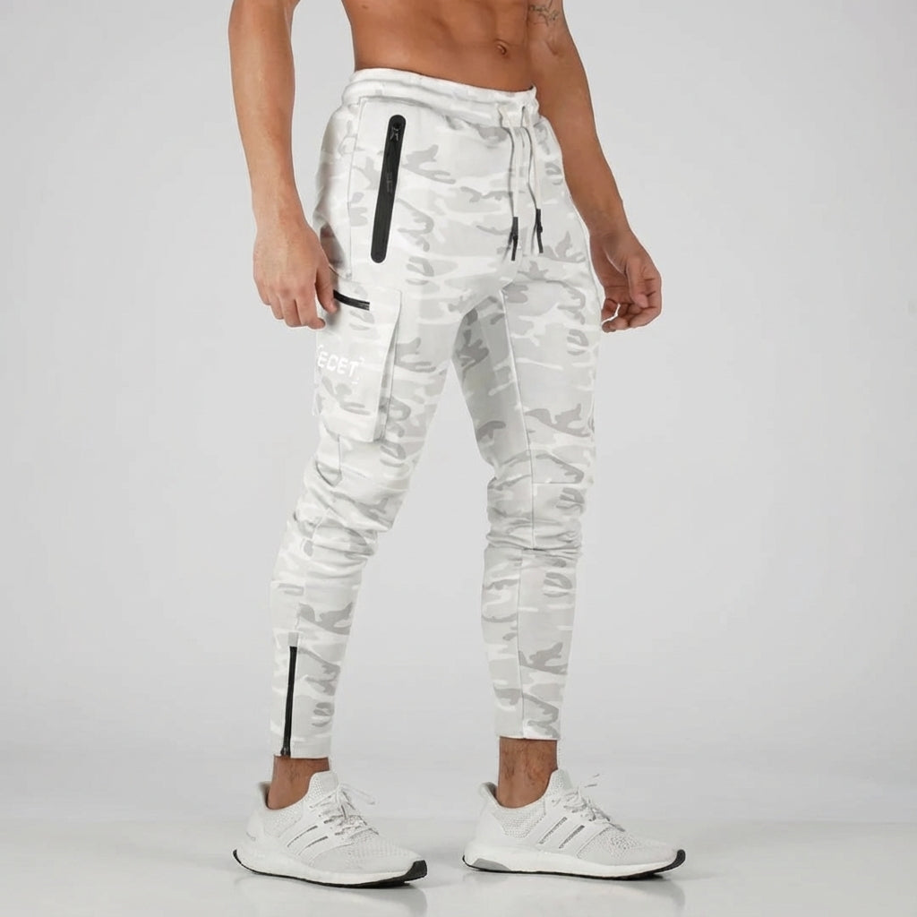 Sporty men's tapered fit joggers, ideal for activewear. Features secure zipper pockets & adjustable drawstring.