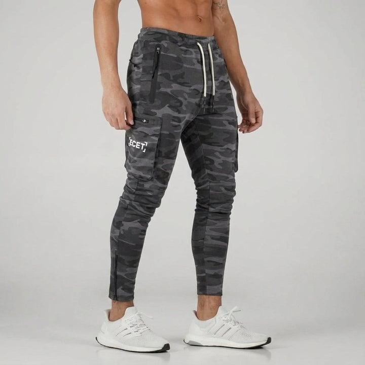 Men's tapered activewear joggers with secure zipper pockets for essentials. Perfect for workouts & casual wear.
