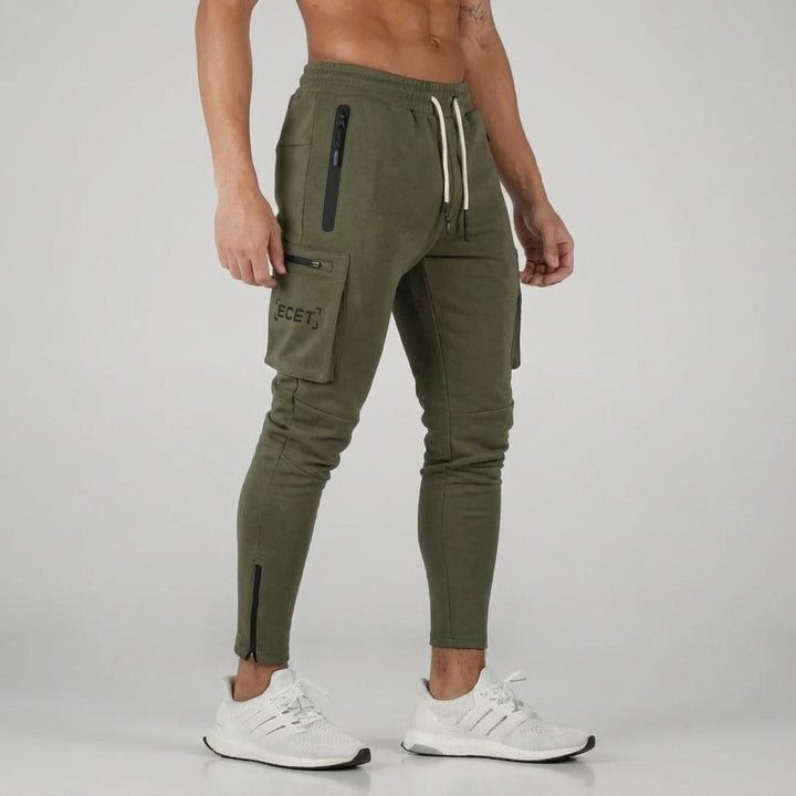Stylish men's tapered athletic pants with secure zipper pockets & drawstring. Perfect for active wear.
