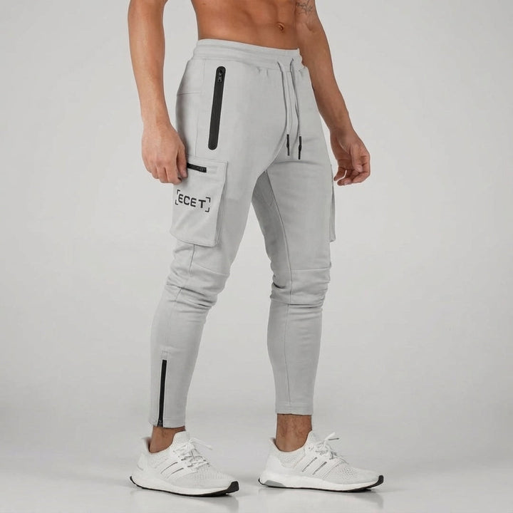 Sporty men's athletic pants: tapered joggers with secure zipper pockets. Ideal activewear for running & training.