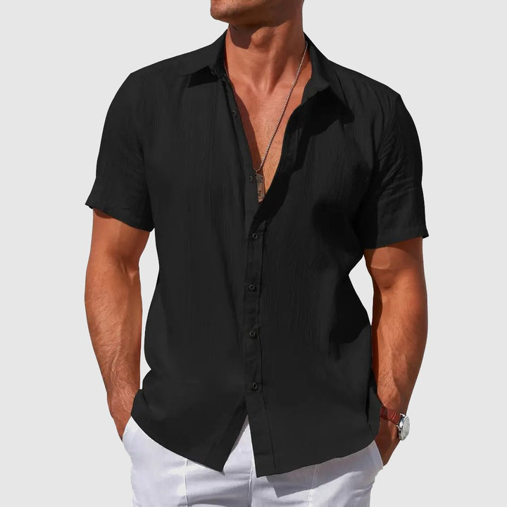 Relaxed fit men's button-front t-shirt with texture. Perfect short sleeve top for casual summer apparel.