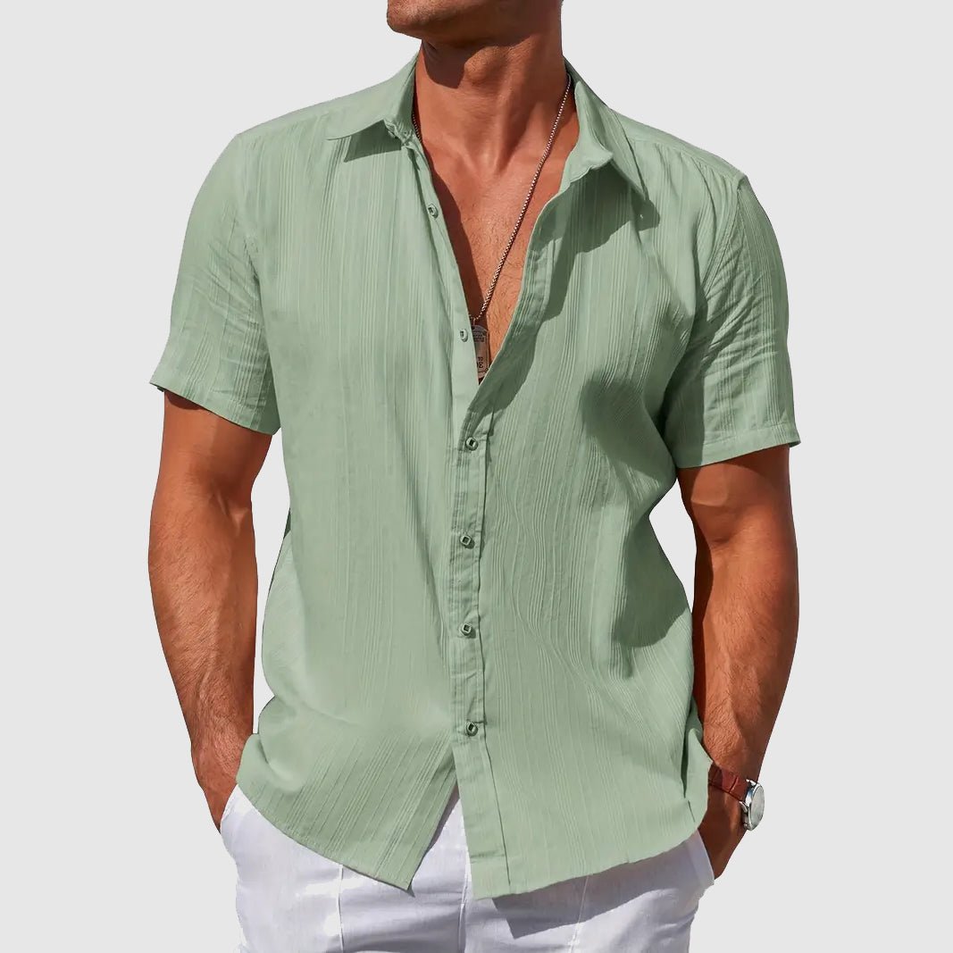 Men's summer fashion: textured short-sleeve button-up top. Comfortable and casual for everyday style.