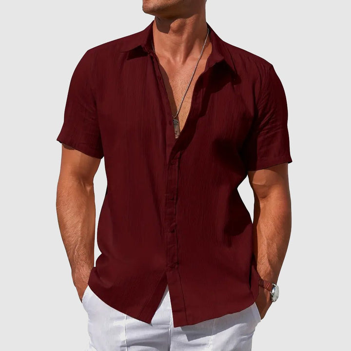 Versatile men's textured casual short-sleeve button-front top for warm weather and summer fashion.