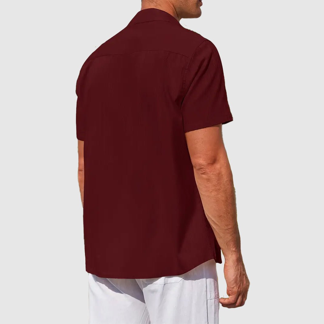 Men's textured button-front short-sleeve shirt. Relaxed fit casual top for everyday summer style.
