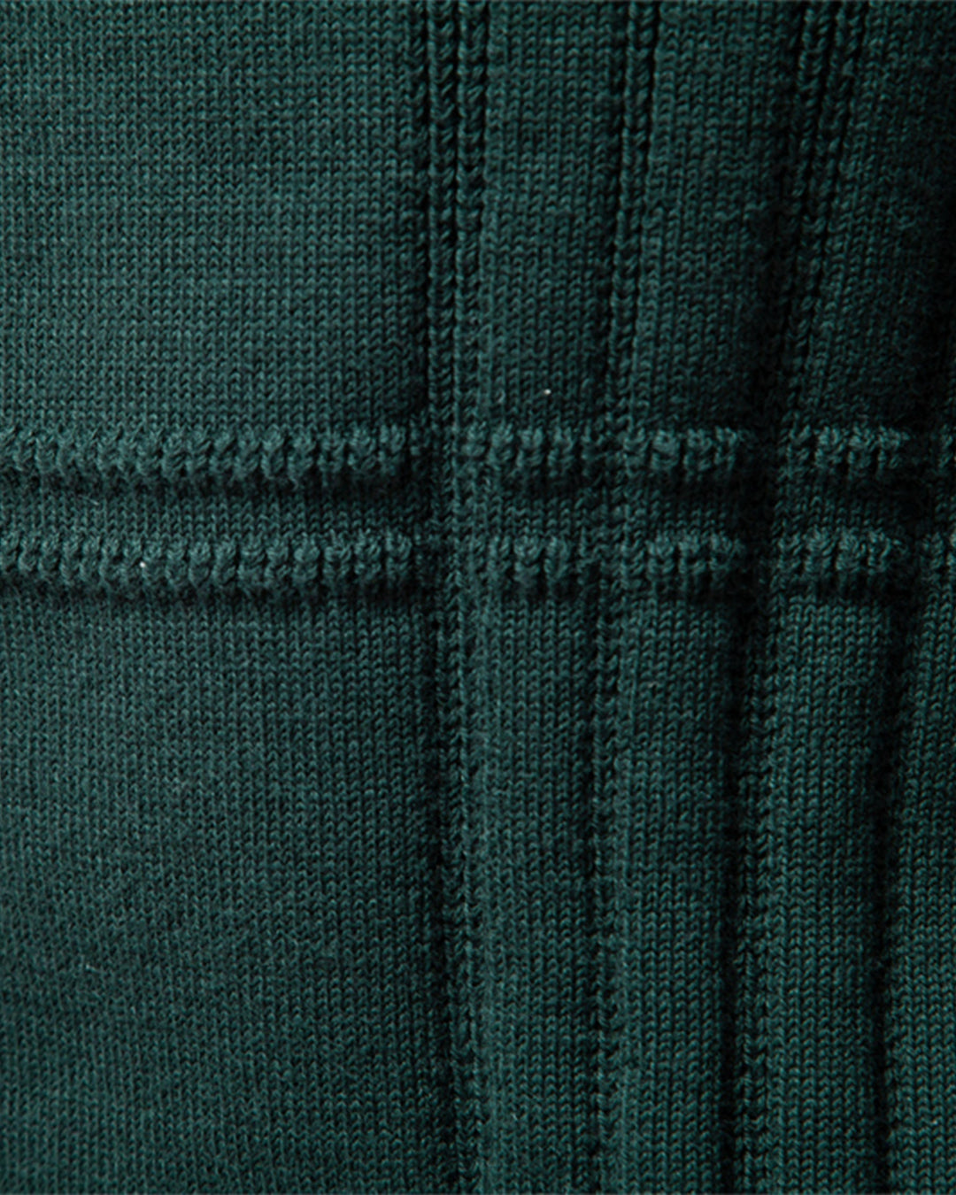 Model smiling while wearing a comfortable men's textured knit crew neck sweater