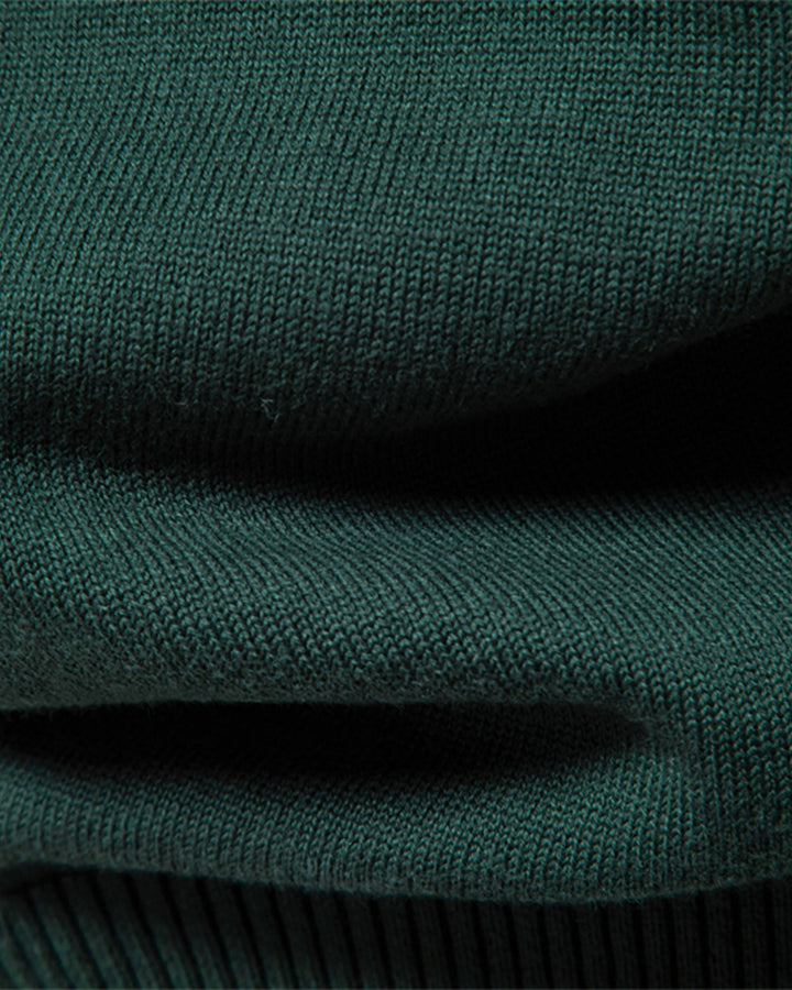 Close-up, showing the soft feel of the premium knit men's crew neck sweater