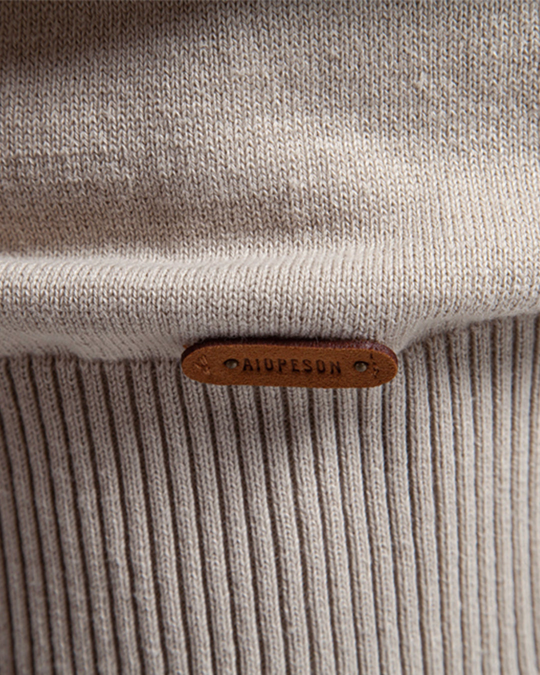 Isolated image of a men's textured crew neck sweater in a unique color