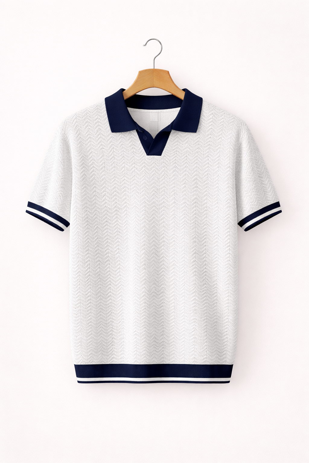 Detail of the collar and button placket on a men's textured short sleeve polo shirt.