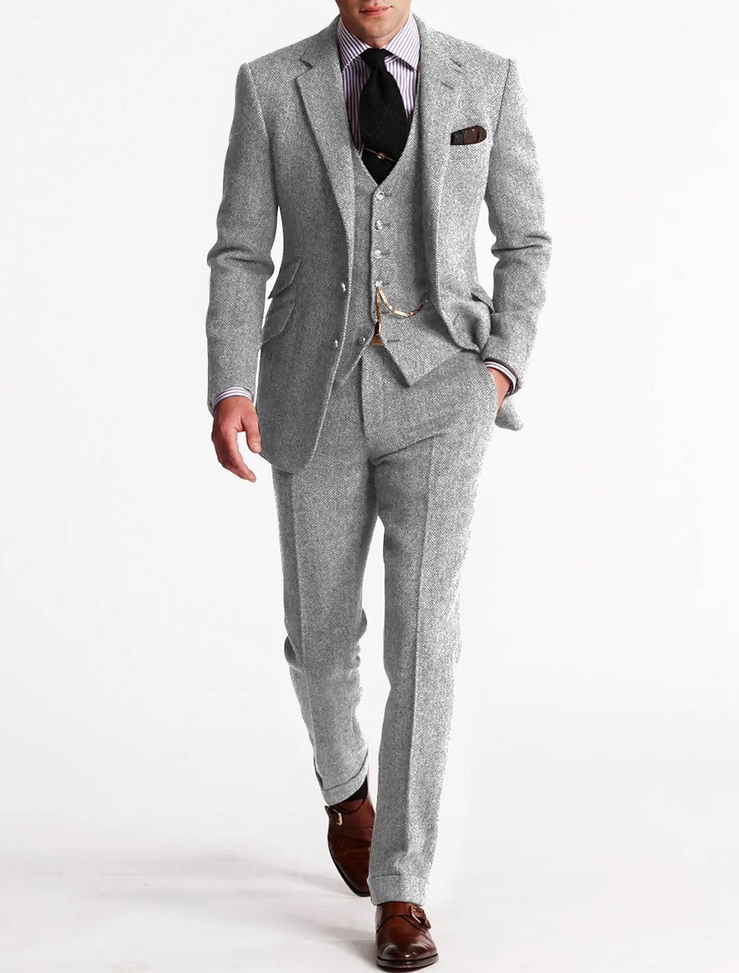 Close-up of the tweed fabric on a men's three-piece suit, highlighting the texture and quality for formal wear.