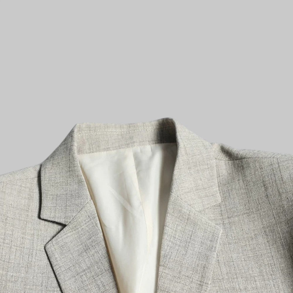 Versatile men's two-button office blazer, suitable for business meetings, smart casual events, and stylish menswear.