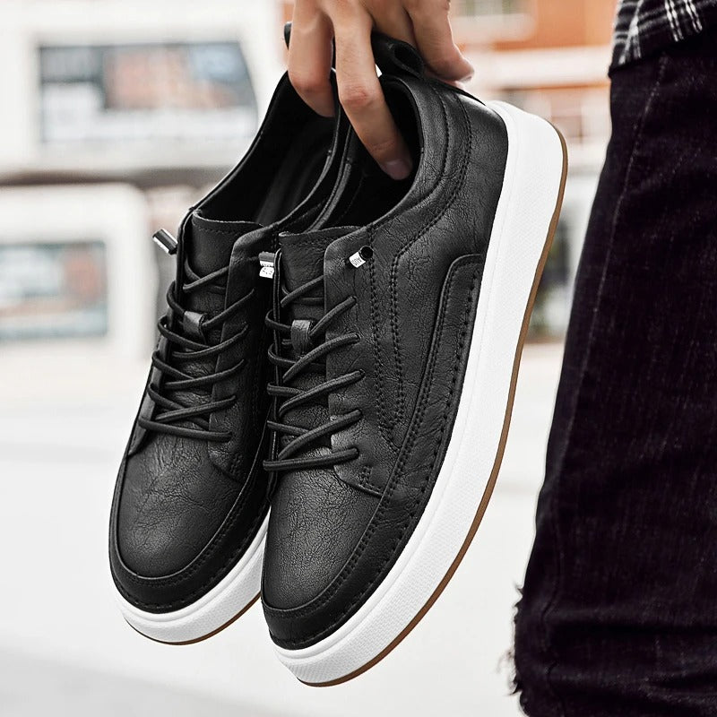 Top view of black men's leather sneakers, simple yet sophisticated casual footwear