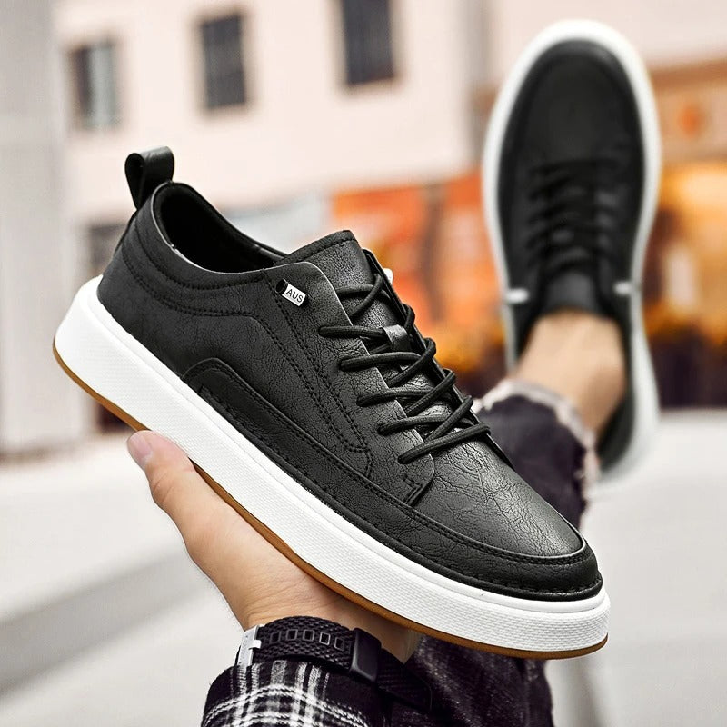 Stylish black cowhide leather sneakers for men, a classic urban footwear choice